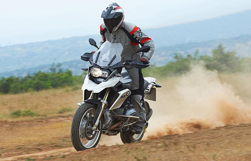 Motorcyclist on Dirt Bike — White