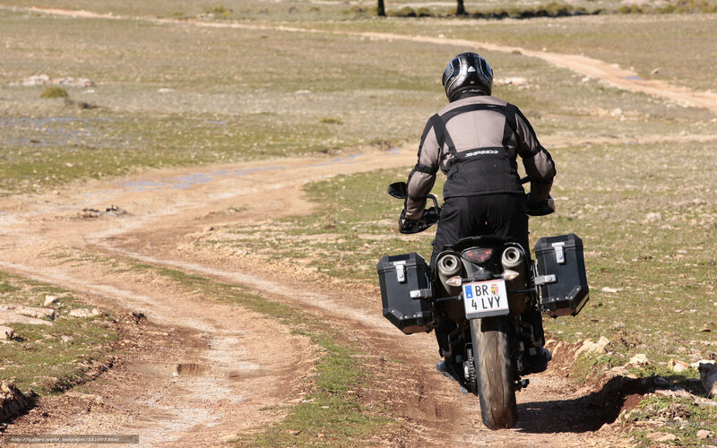 Motorcyclist on Dirt Path — Brown