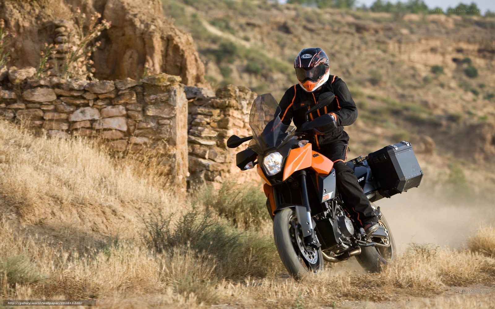 motorcyclist on dirt path