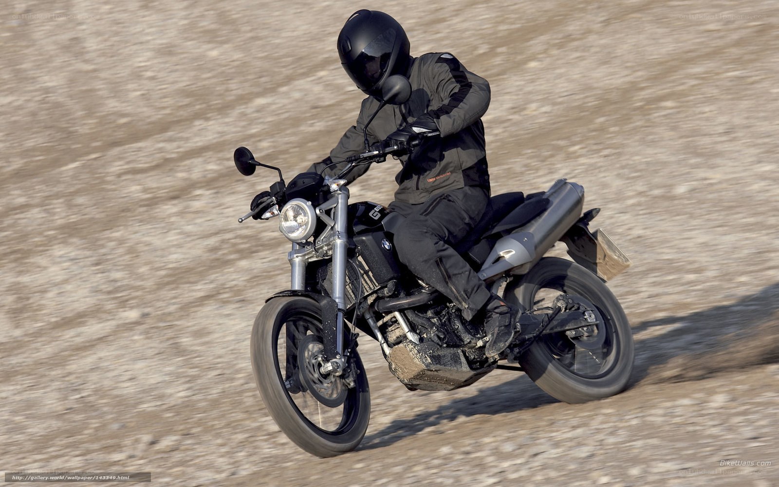 motorcyclist on dirt road