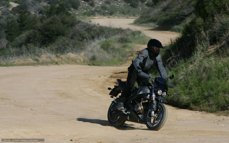 motorcyclist on dirt road