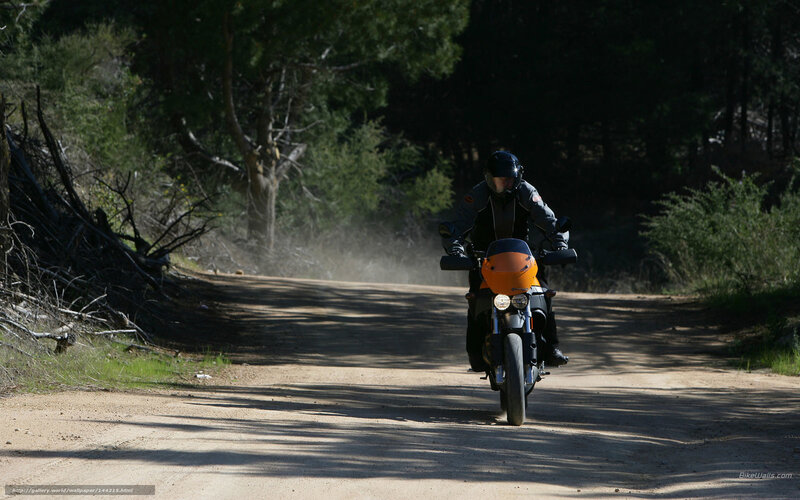 Motorcyclist on Dirt Road — Brown, Outdoor