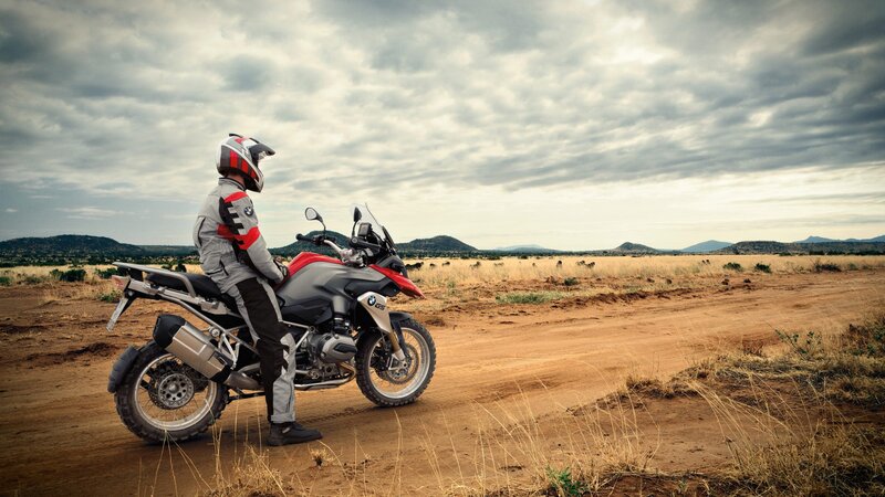 Motorcyclist on Dirt Road — Brown, Serene