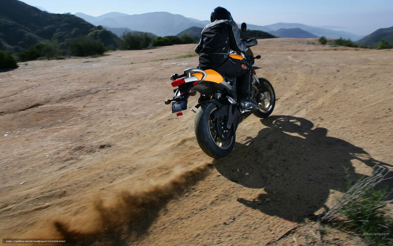 Motorcyclist on Dirt Road — Brown