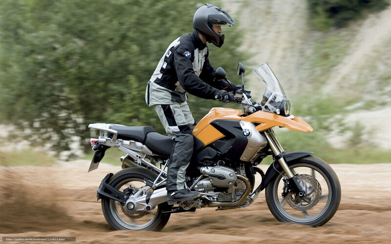 Motorcyclist on Dirt Road — Orange