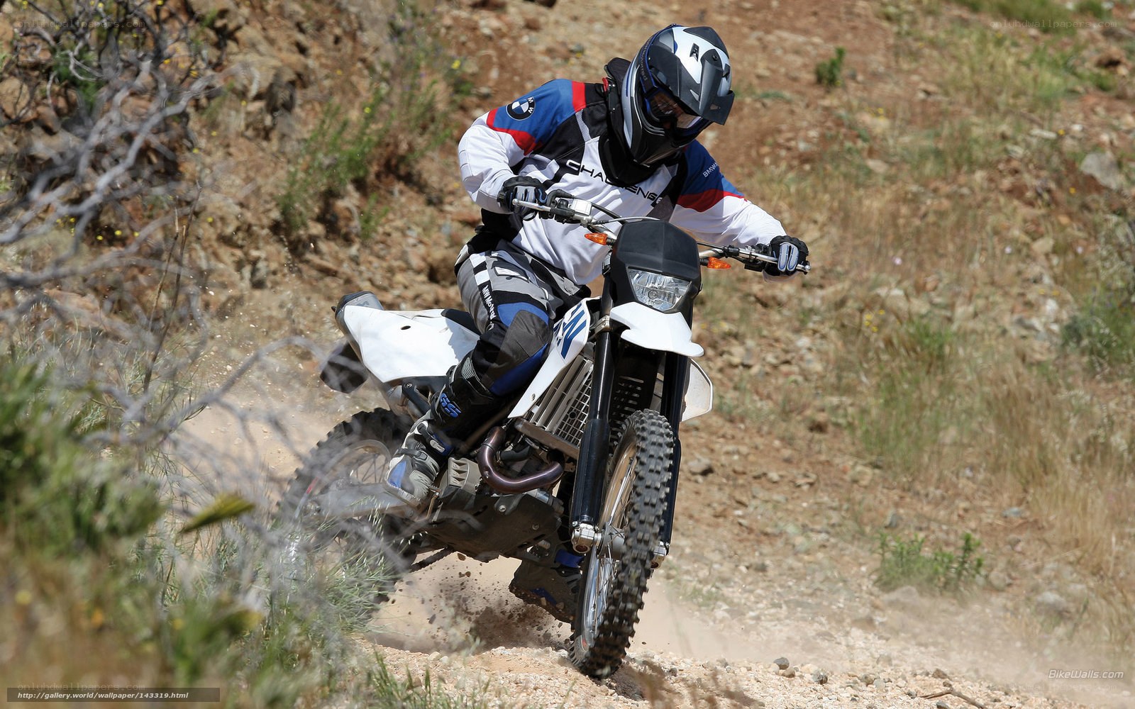 motorcyclist on dirt trail