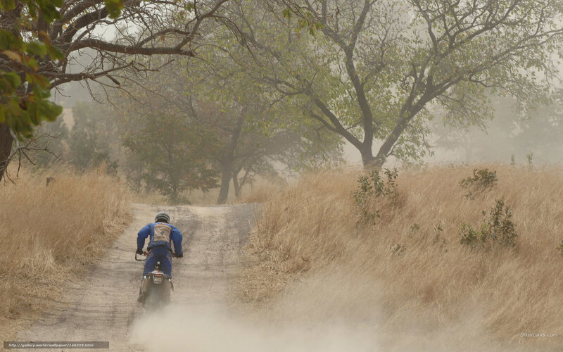 motorcyclist on dusty trail