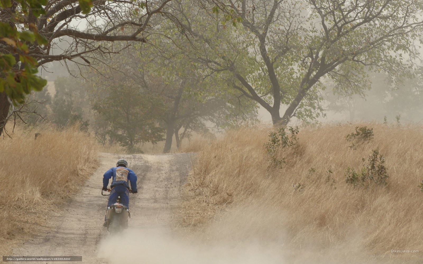 motorcyclist on dusty trail