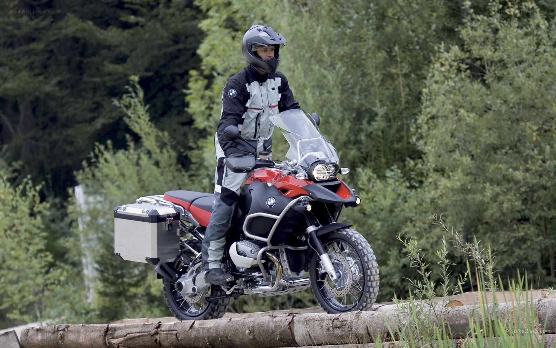 Motorcyclist on forest trail