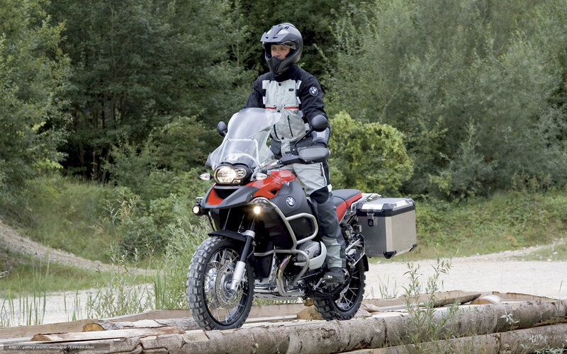 motorcyclist on forest trail