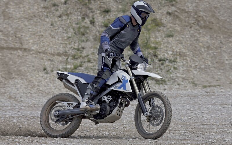 motorcyclist on gravel terrain