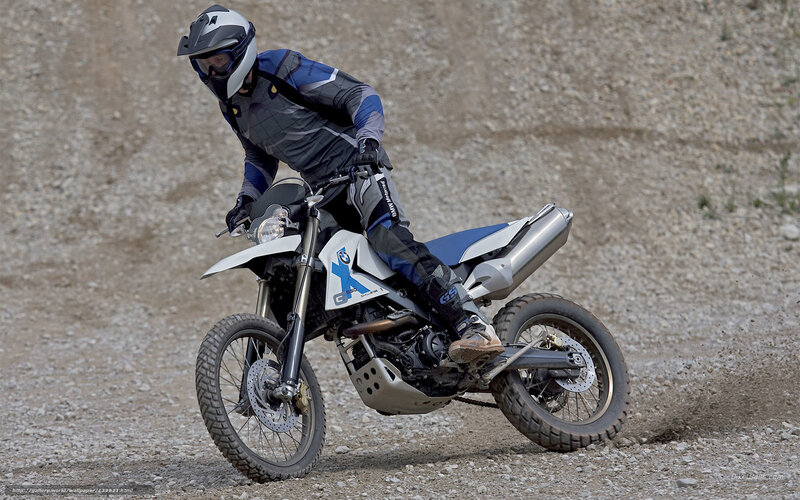 motorcyclist on gravel terrain