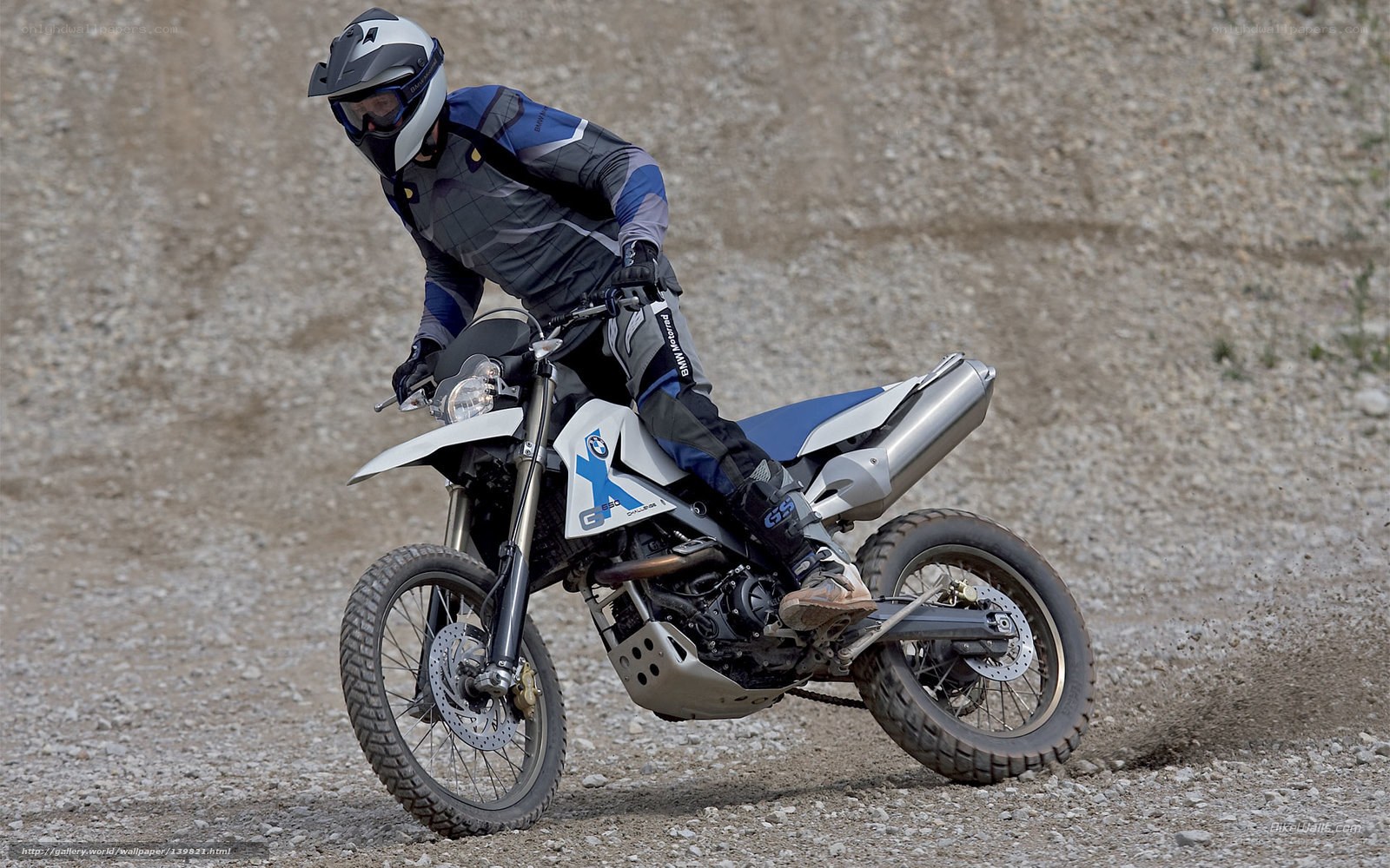 motorcyclist on gravel terrain