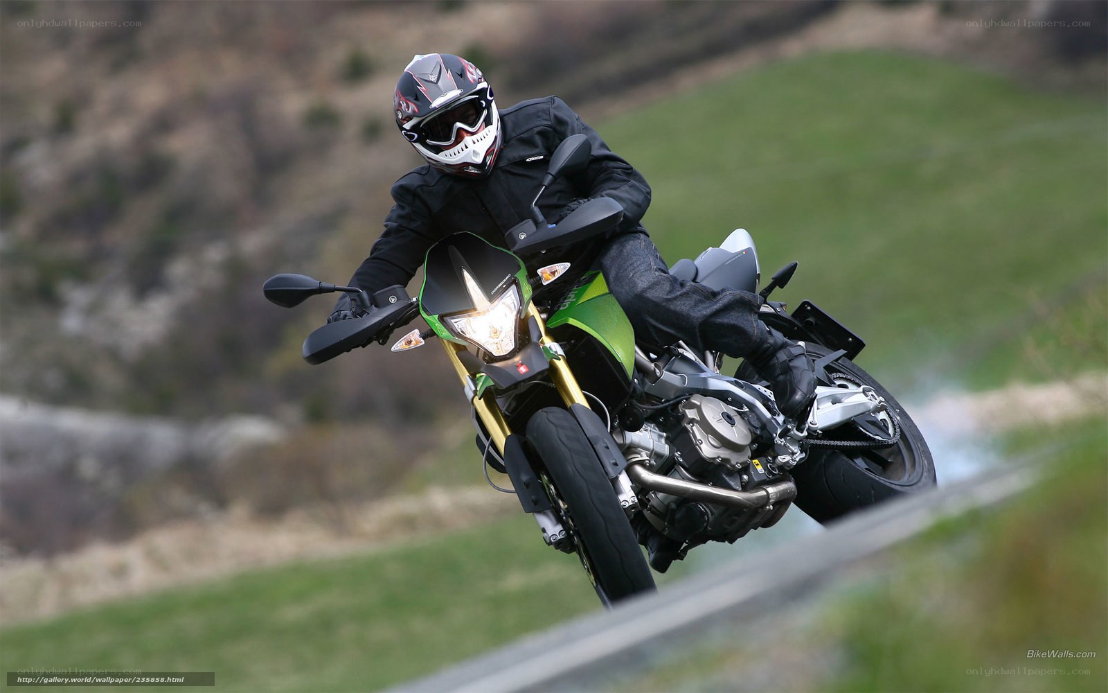motorcyclist on green bike
