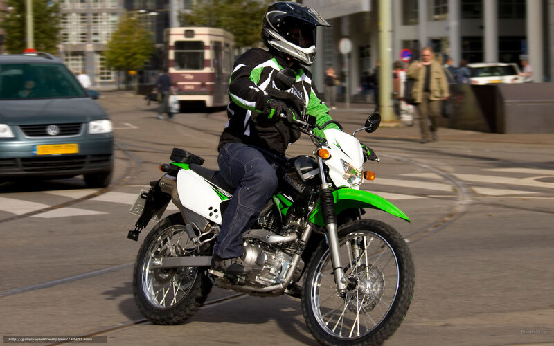 Motorcyclist on Green Bike — Active