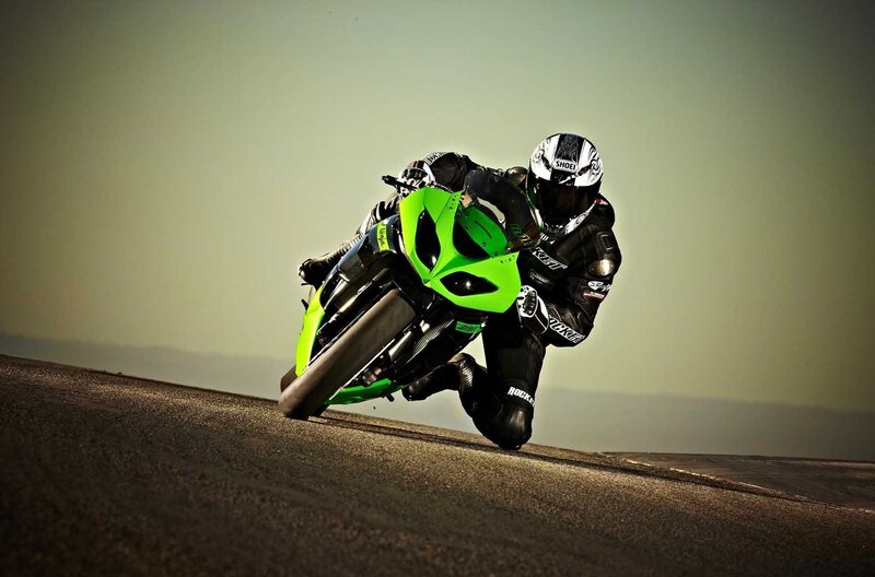 Motorcyclist on Green Bike — Dramatic, Sunset