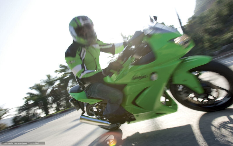 Motorcyclist on Green Bike — Dynamic, Afternoon, Photograph, Helmet, Palm Trees