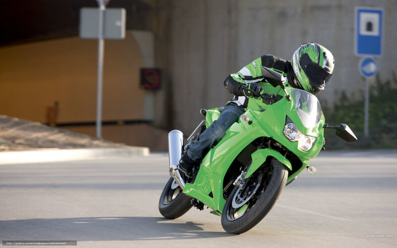 Motorcyclist on Green Bike — Dynamic, Afternoon, Photograph, Road
