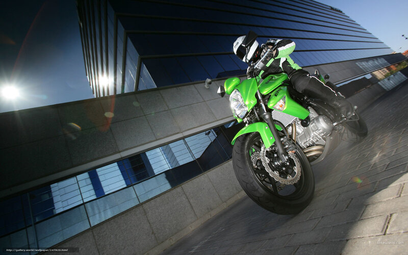 Motorcyclist on Green Bike — Dynamic, Afternoon, Photograph