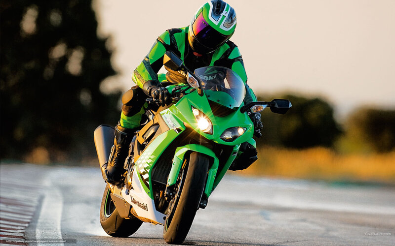 Motorcyclist on Green Bike — Dynamic, Sunset