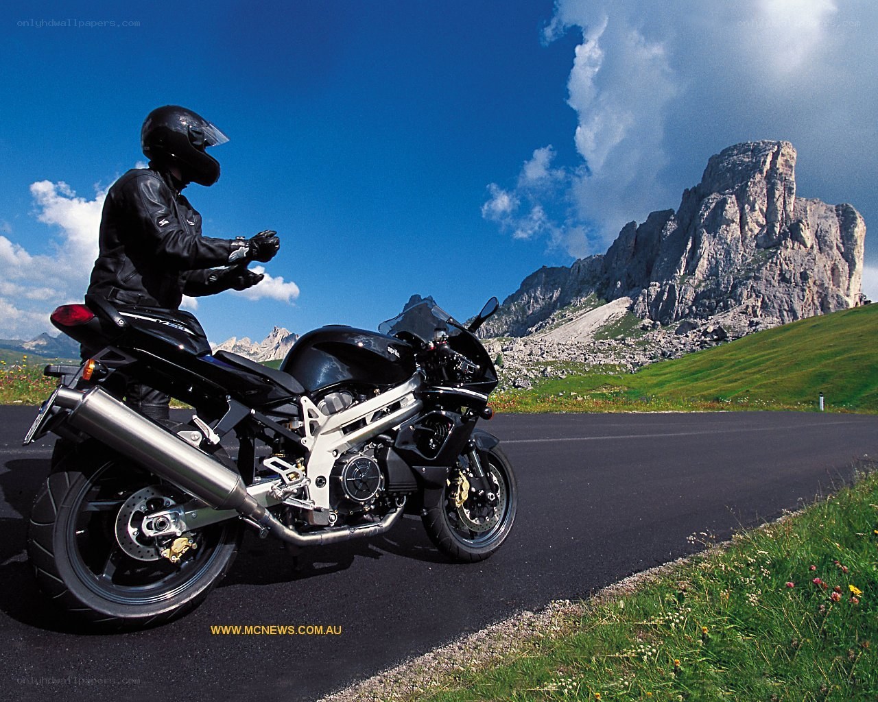 Motorcyclist on mountain road