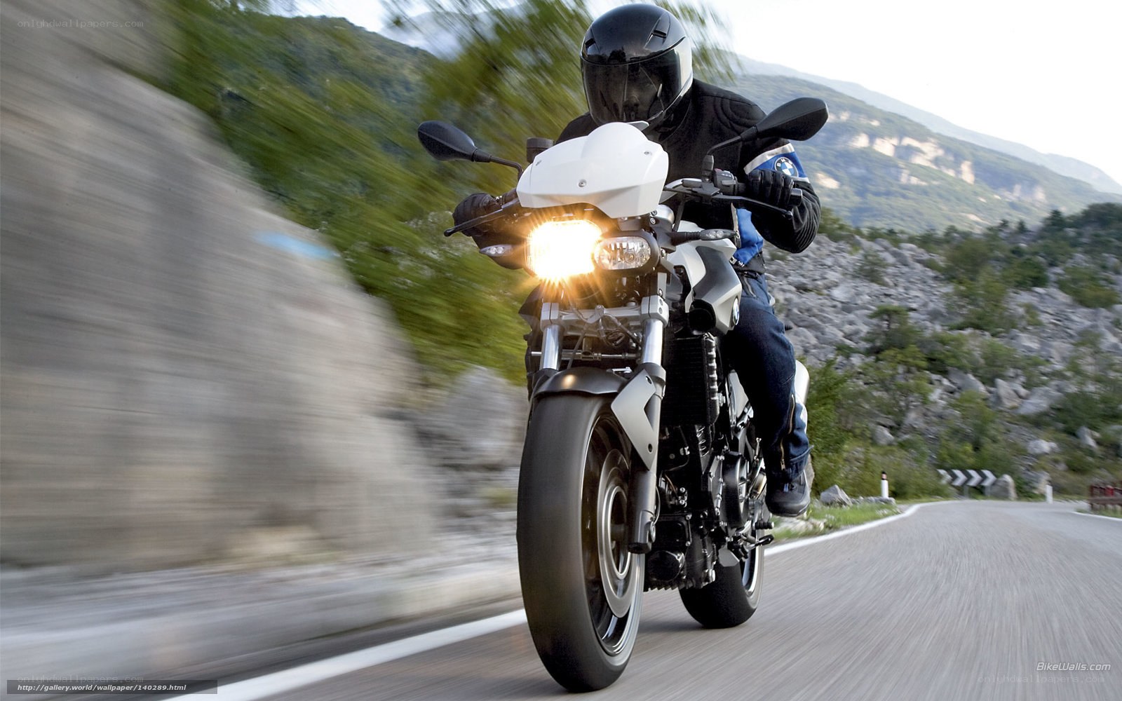 motorcyclist on mountain road