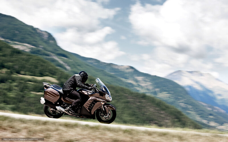 Motorcyclist on Mountain Road — Brown
