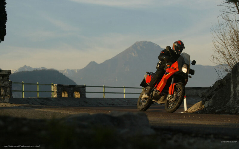 Motorcyclist on Mountain Road — Orange