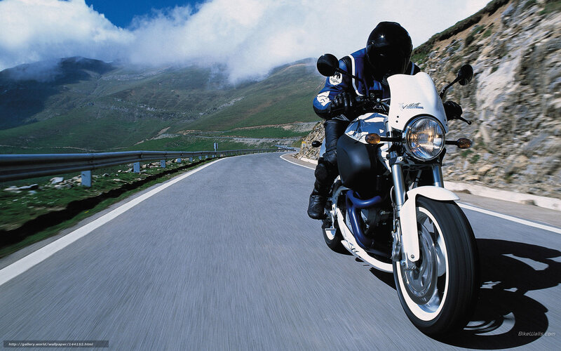 Motorcyclist on Mountain Road — White