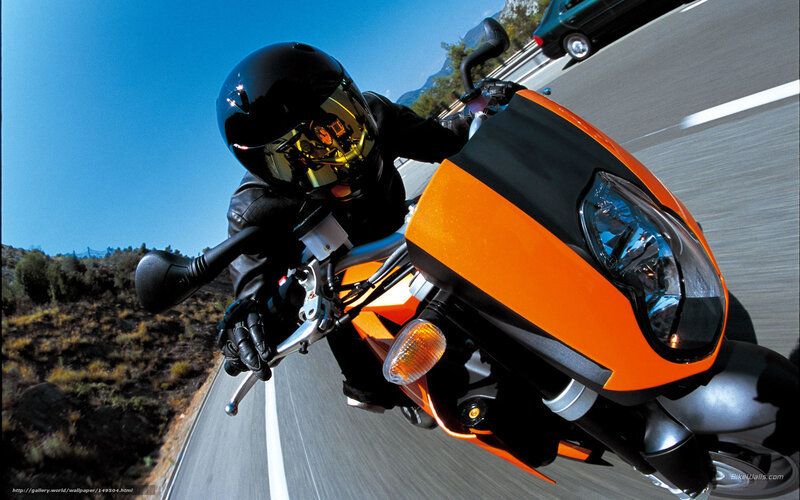 motorcyclist on orange bike