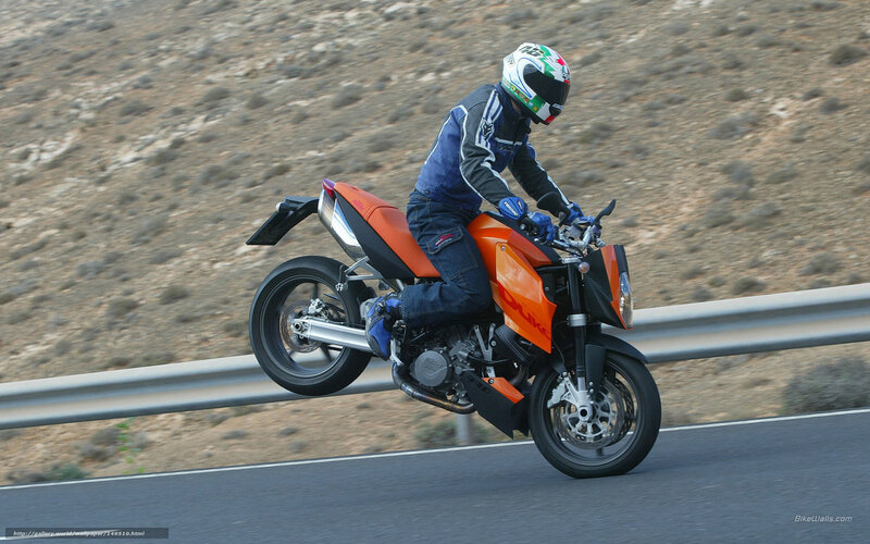 motorcyclist on orange bike