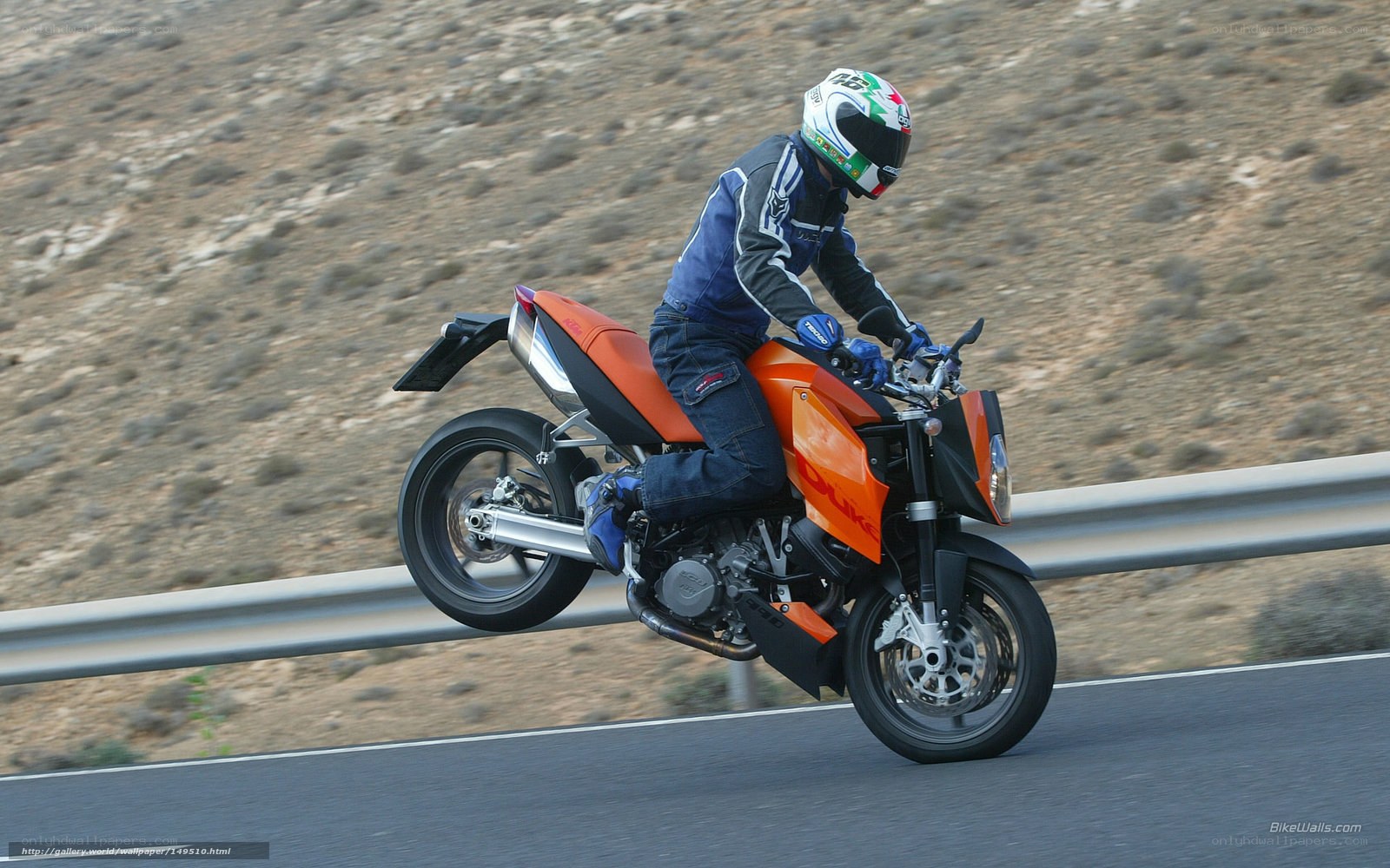 motorcyclist on orange bike
