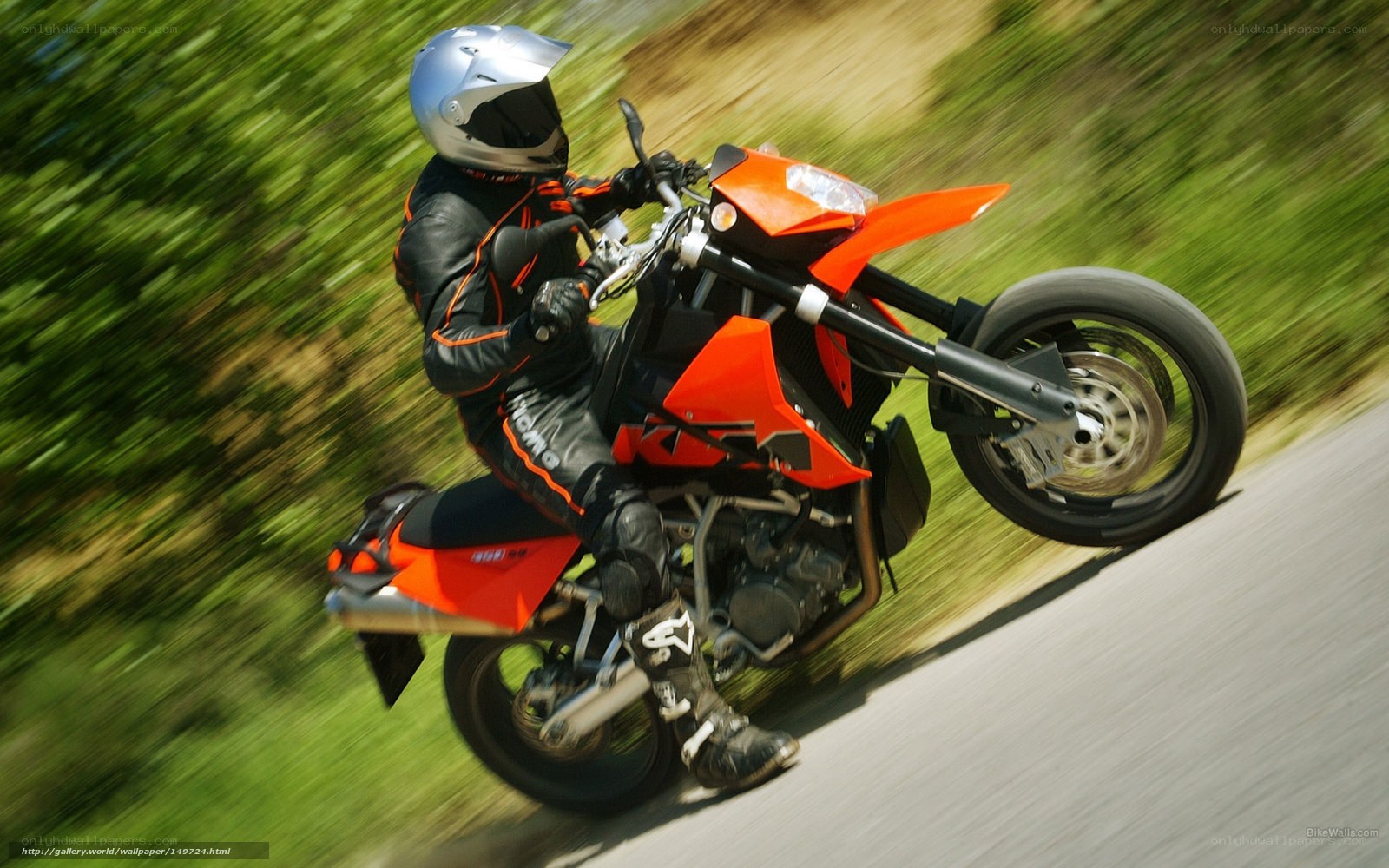 motorcyclist on orange bike