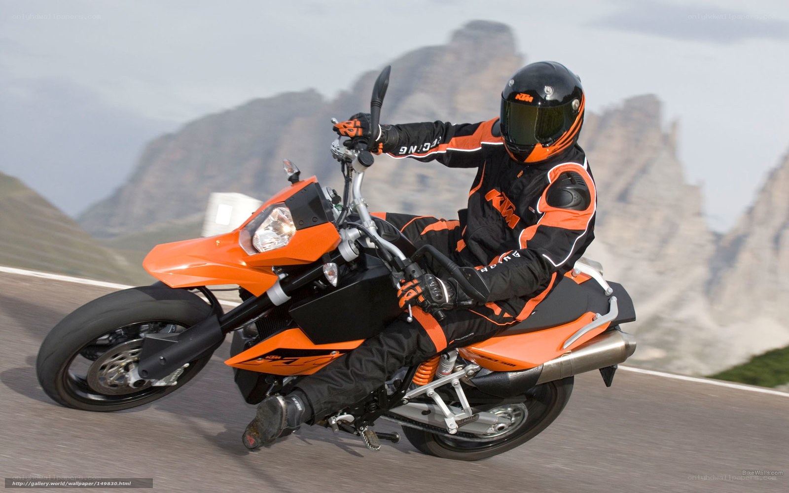 motorcyclist on orange bike
