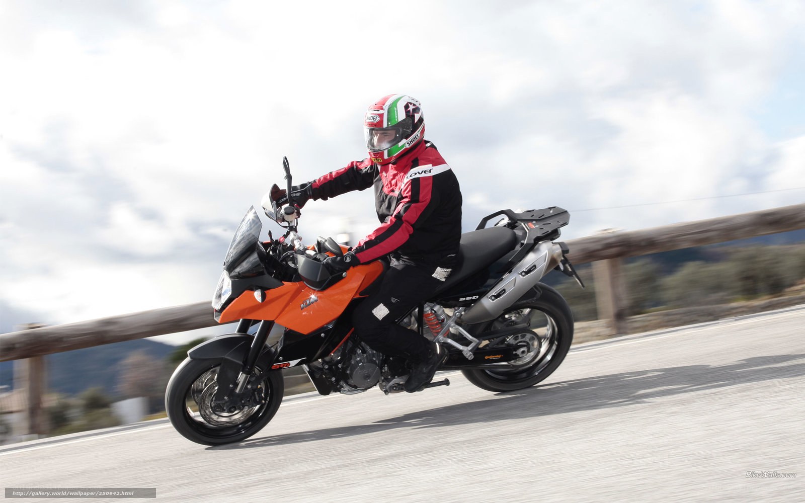 motorcyclist on orange bike
