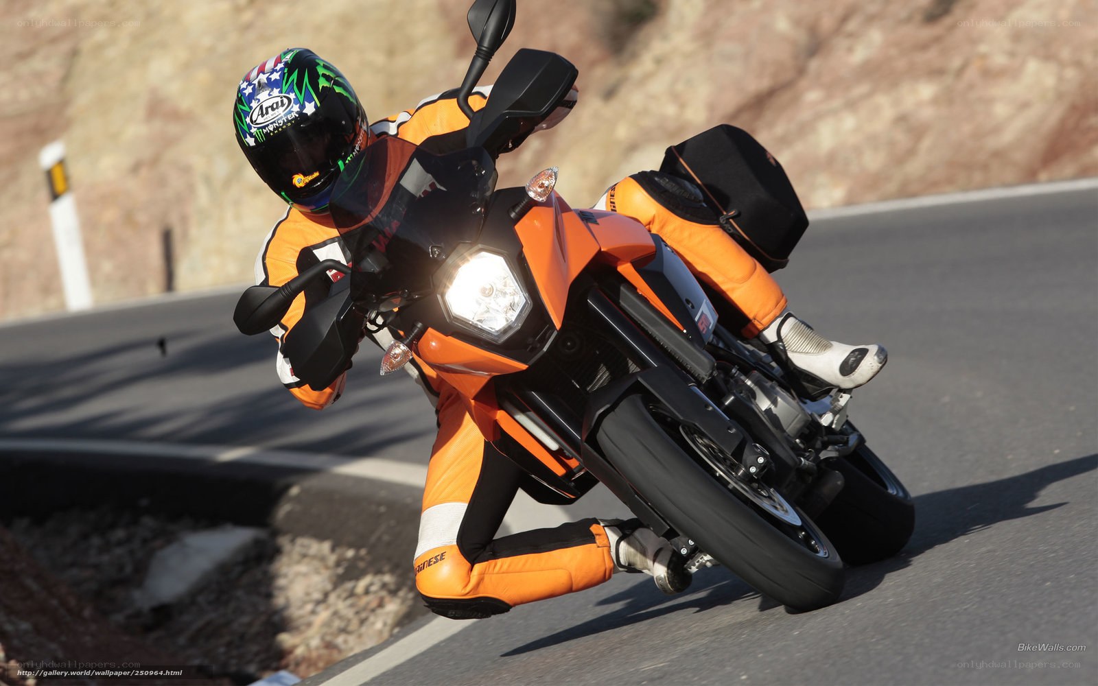 motorcyclist on orange bike