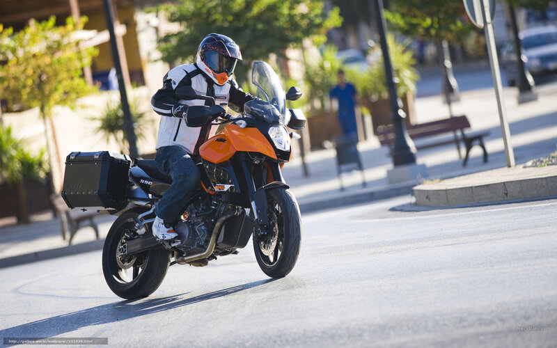 motorcyclist on orange bike