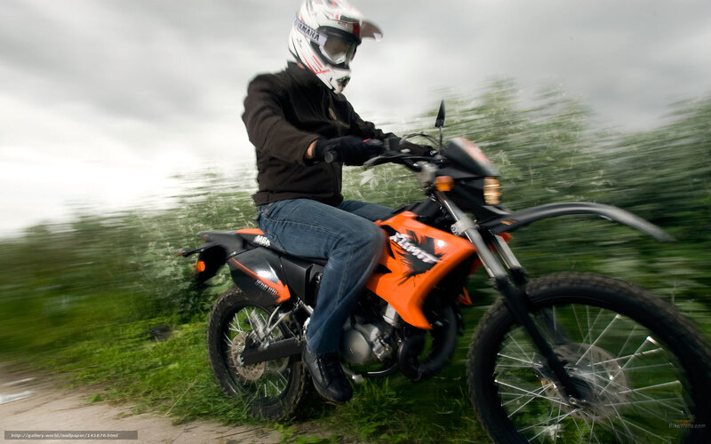 motorcyclist on orange bike