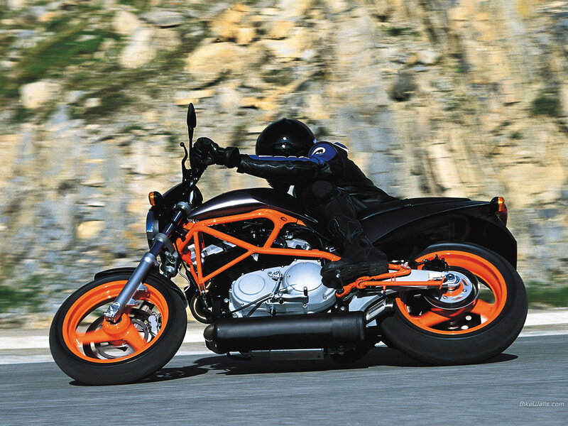 motorcyclist on orange bike