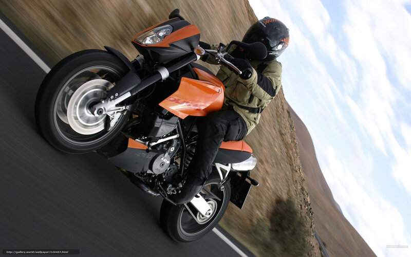 motorcyclist on orange bike