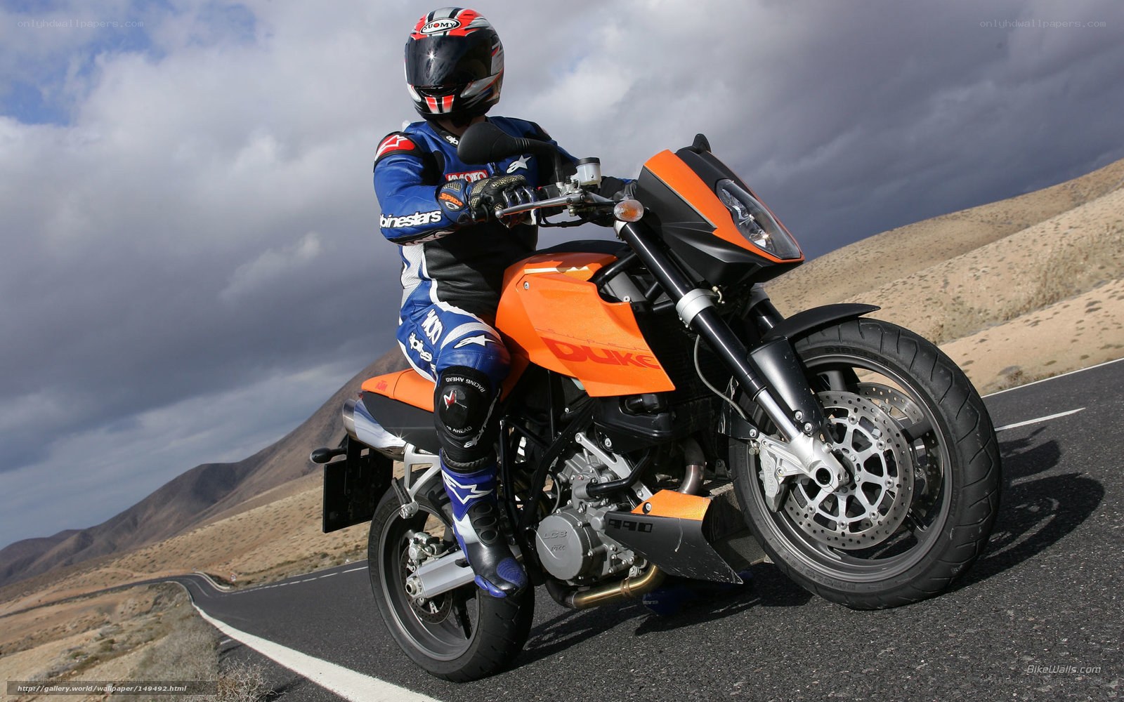 motorcyclist on orange bike
