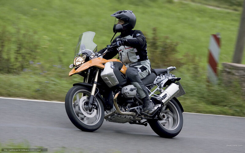 Motorcyclist on Orange Bike — Active