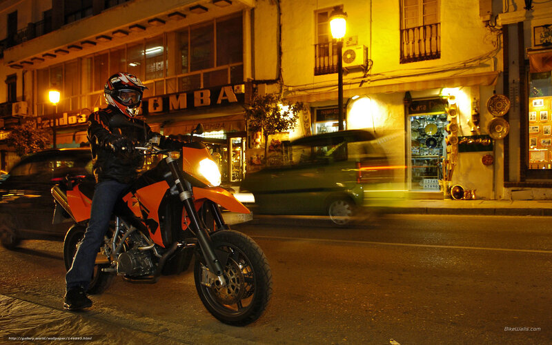 Motorcyclist on Orange Bike — Dramatic, Night