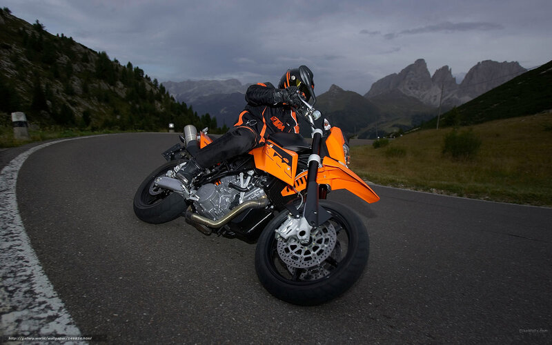Motorcyclist on Orange Bike — Dramatic, Sunset