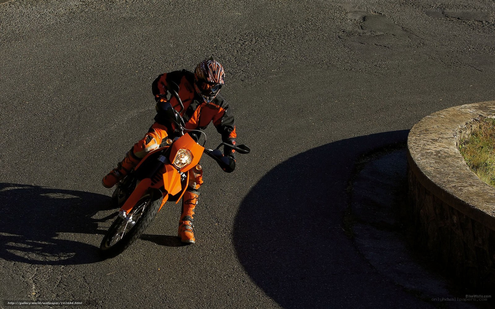 motorcyclist on orange bike