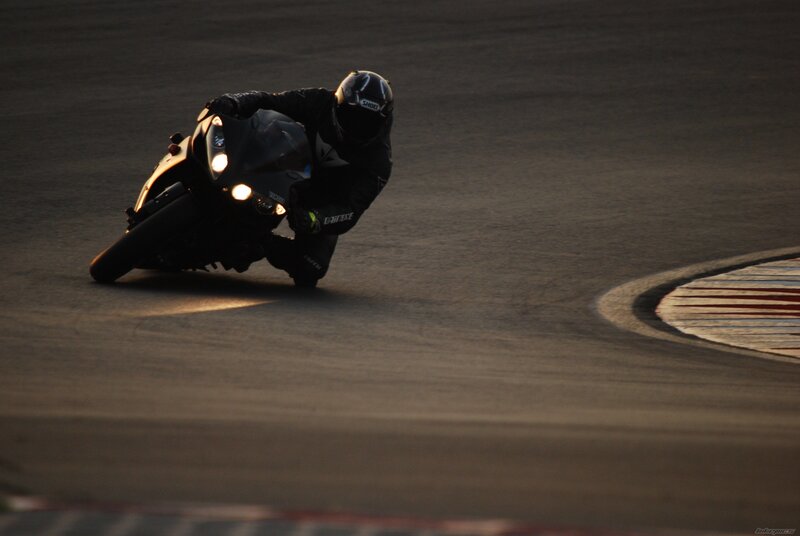 Motorcyclist on Racetrack — Black, Dramatic