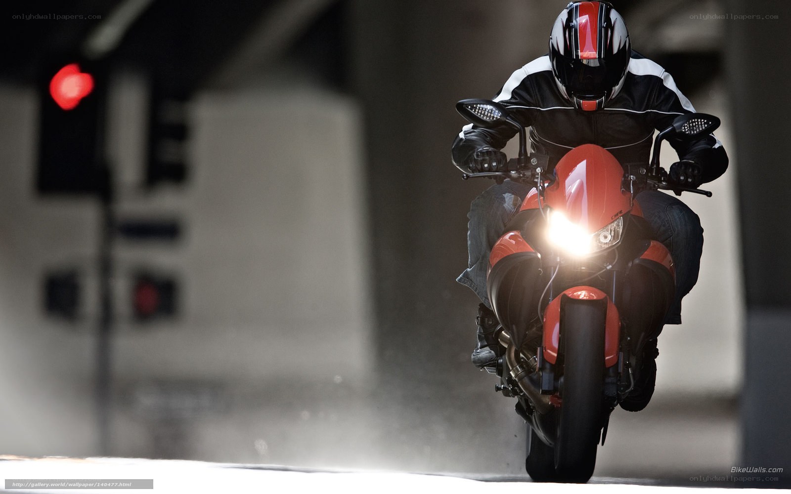 Motorcyclist on red bike