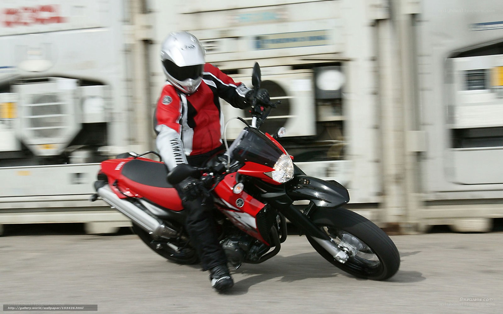 motorcyclist on red bike