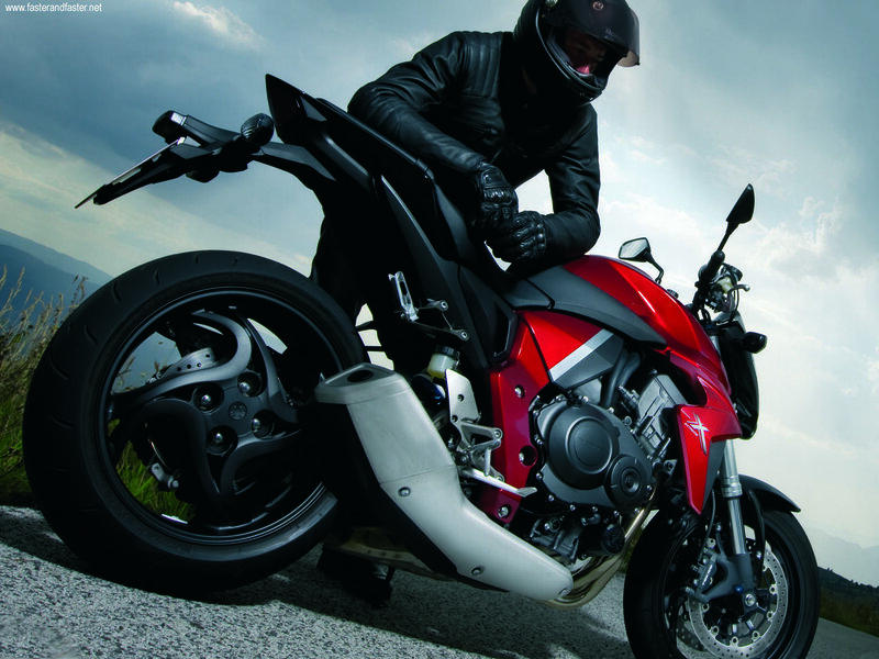 motorcyclist on red bike