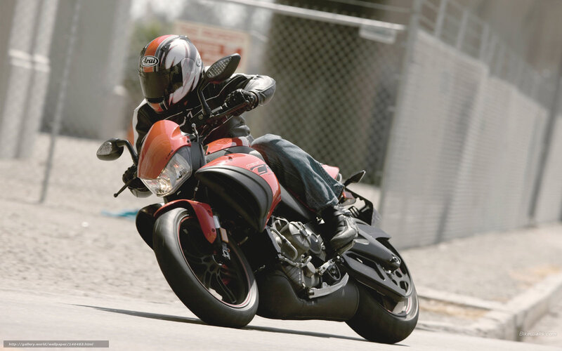 Motorcyclist on Red Bike — Dynamic, Afternoon, Photograph, Helmet